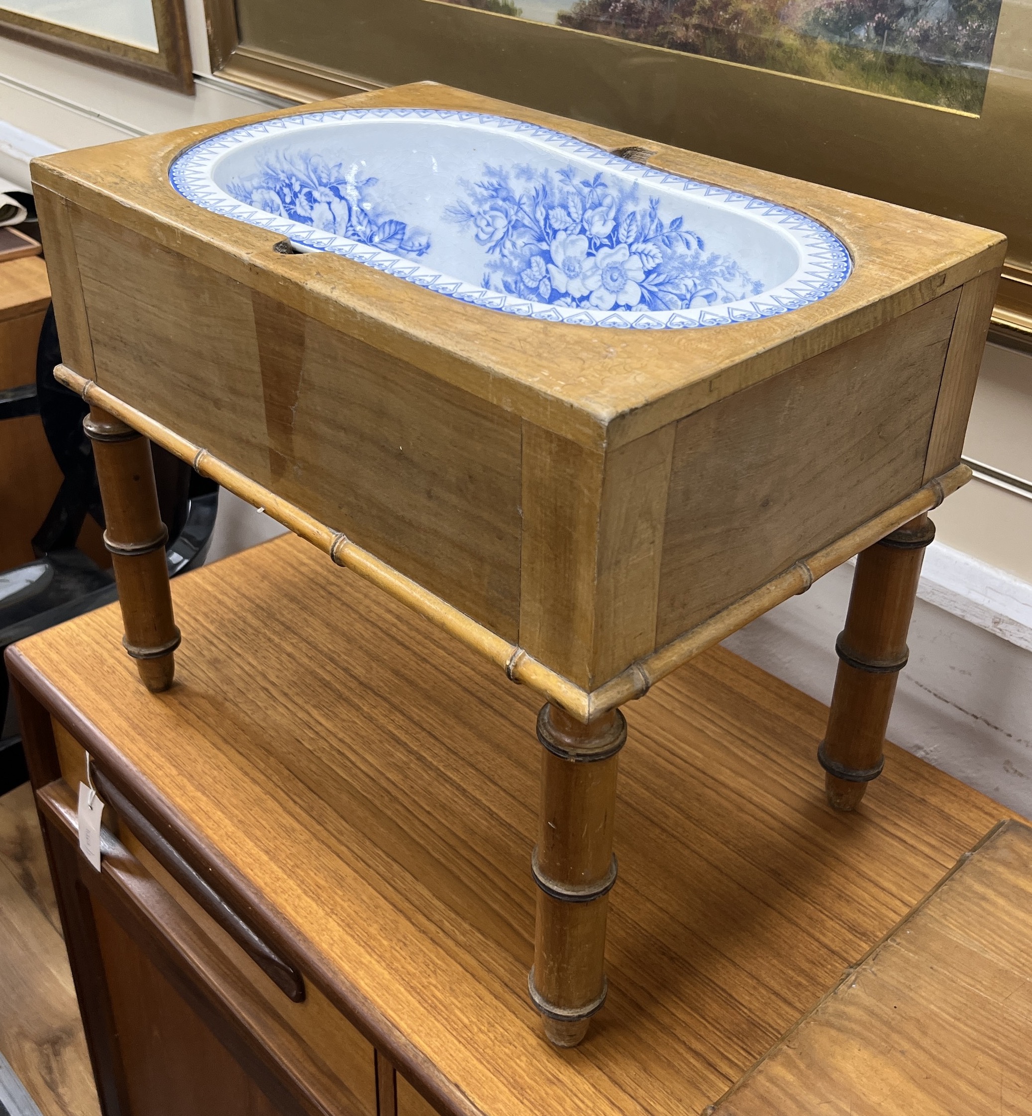 A 19th century French faux bamboo rectangular bidet with blue and white ceramic liner, width 52cm, depth 36cm, height 42cm